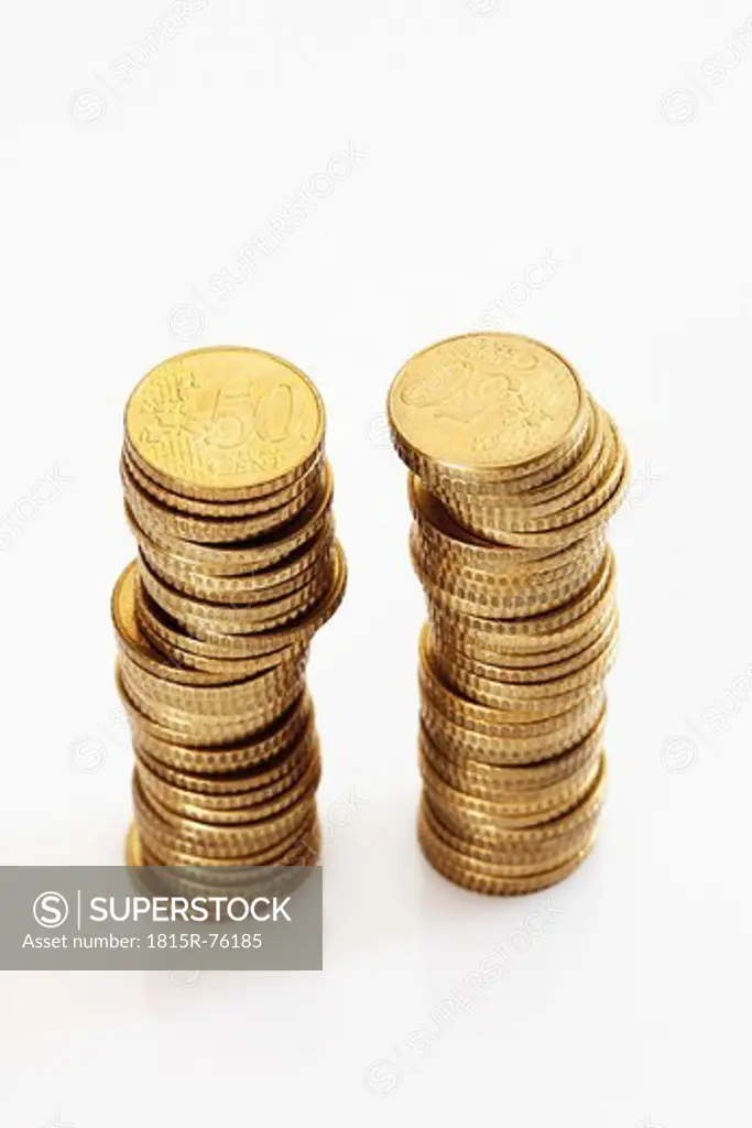 Stacks of 50 Cents on white background