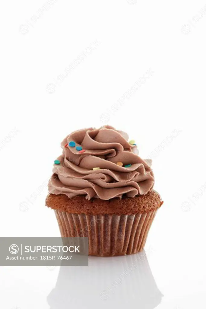Close up of buttercream chocolate cupcake against white background