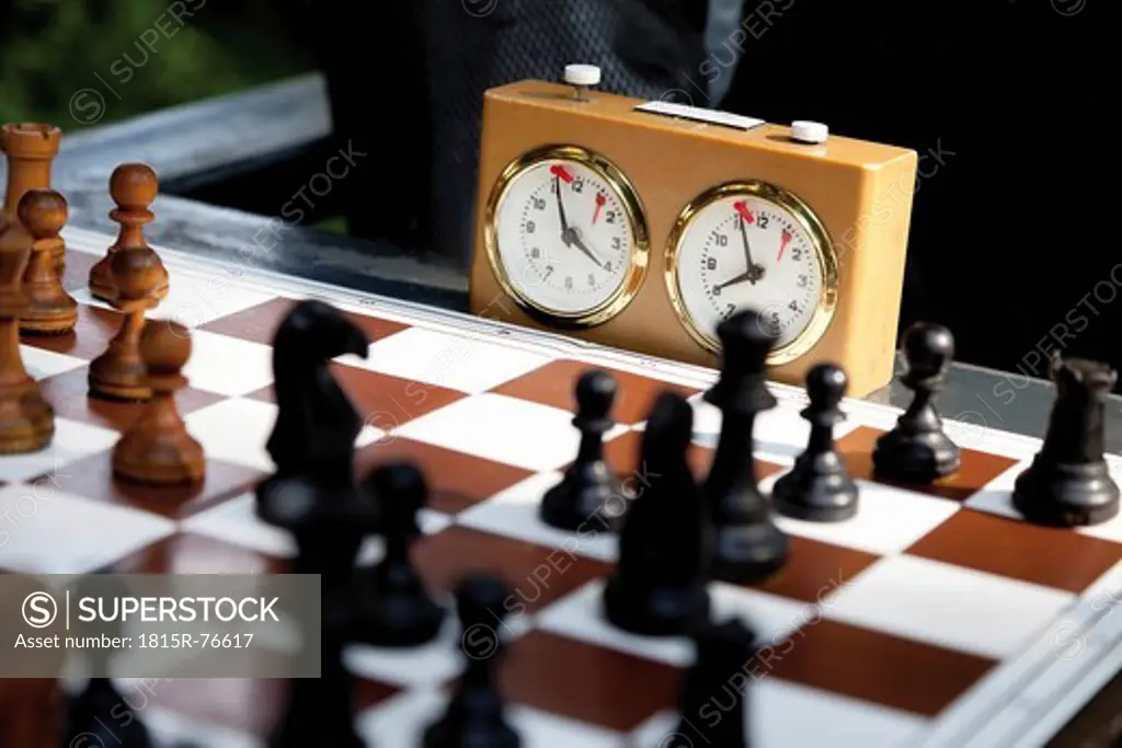 Germany, Close up of chess game with stop watch