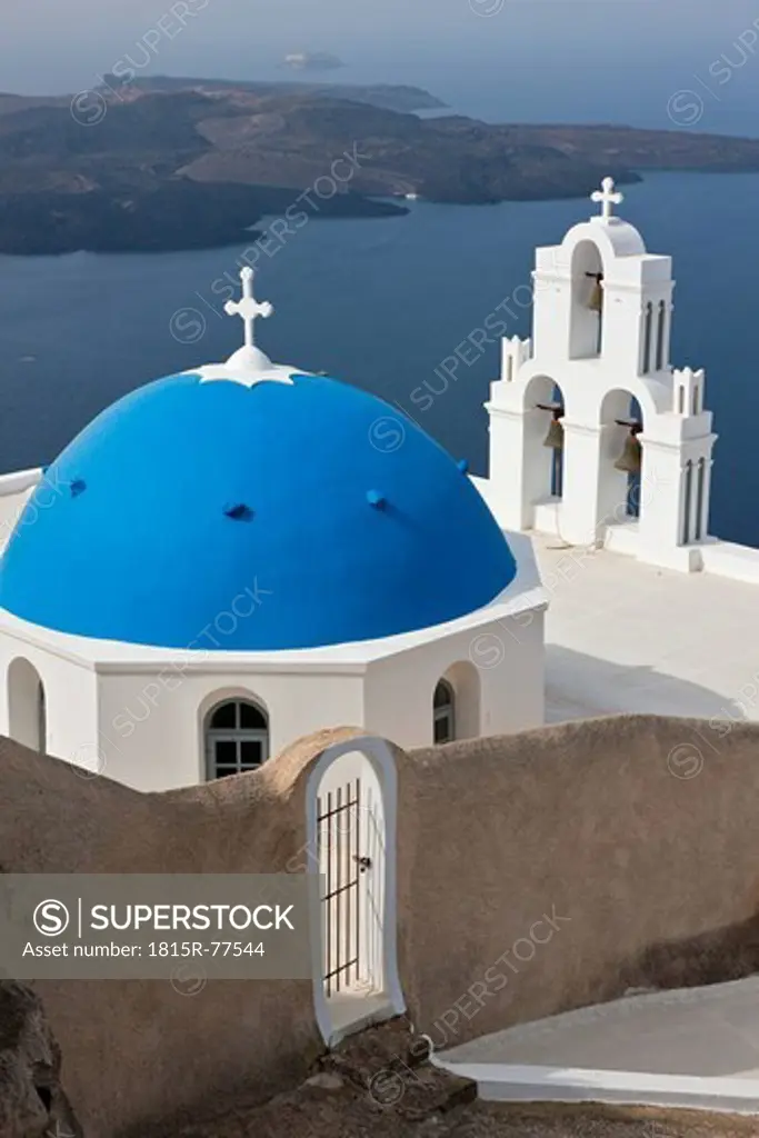Greece, Cyclades, Thira, Santorini, Bell tower and dome of a church firostefani with aegean sea