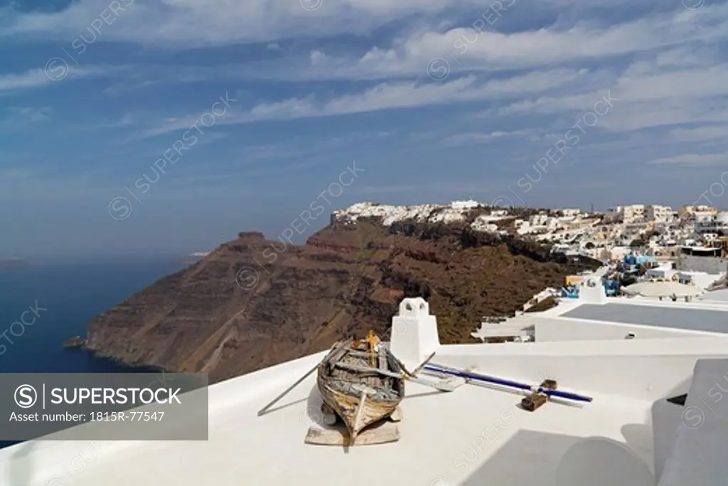 Greece, Cyclades, Thira, Santorini, Old rowboat on rooftop terrace