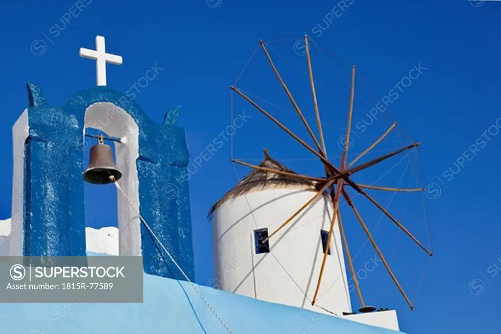 Europe, Greece, Aegean Sea, Cyclades, Thira, Santorini, Oia, View of bell tower and wind mill