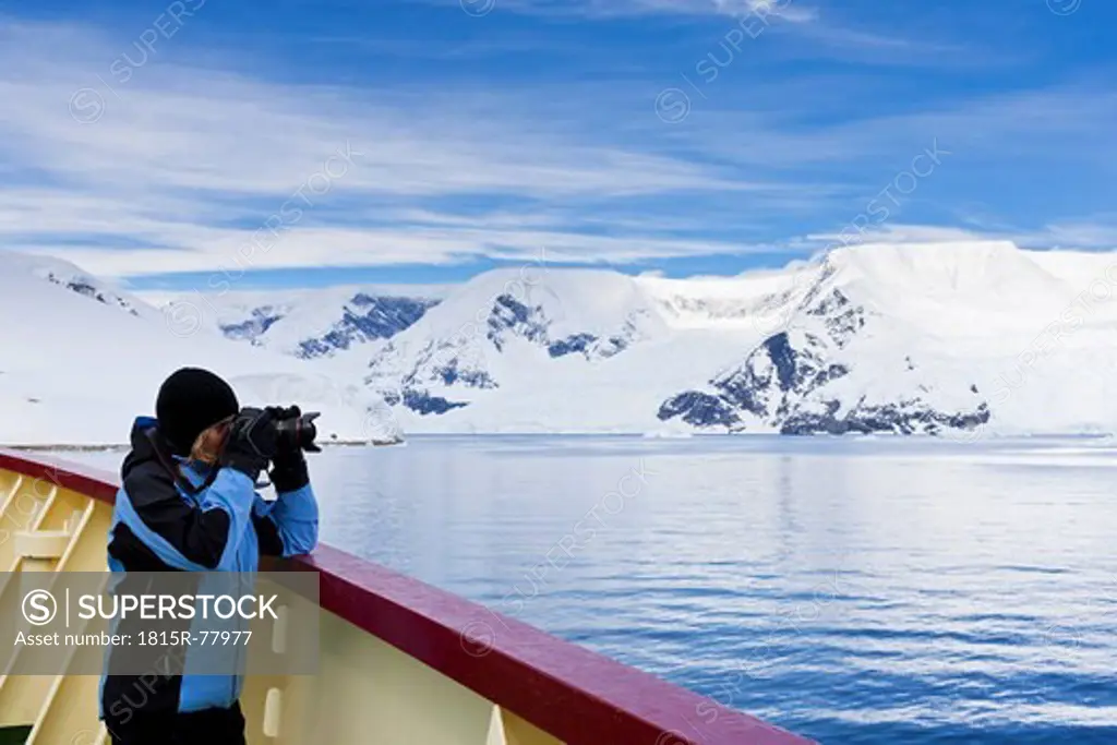 South Atlantic Ocean, Antarctica, Antarctic Peninsula, Gerlache Strait, Photographer standing on polar star icebreaker cruise ship