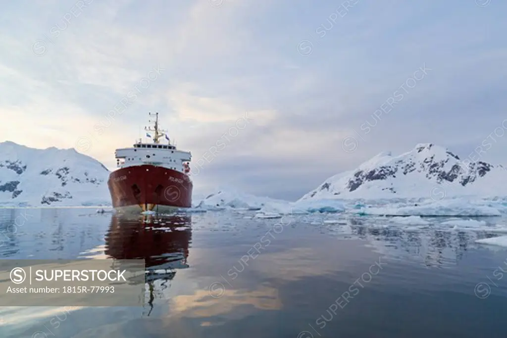 South Atlantic Ocean, Antarctica, Antarctic Peninsula, Gerlache Strait, Paradise Bay, Polar Star icebreaker cruise ship on sea, mountain in background