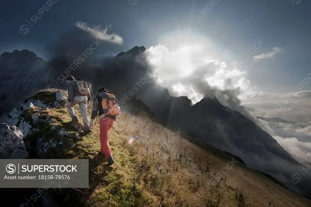 Austria, Salzburg, Filzmoos, Couple hiking on mountains