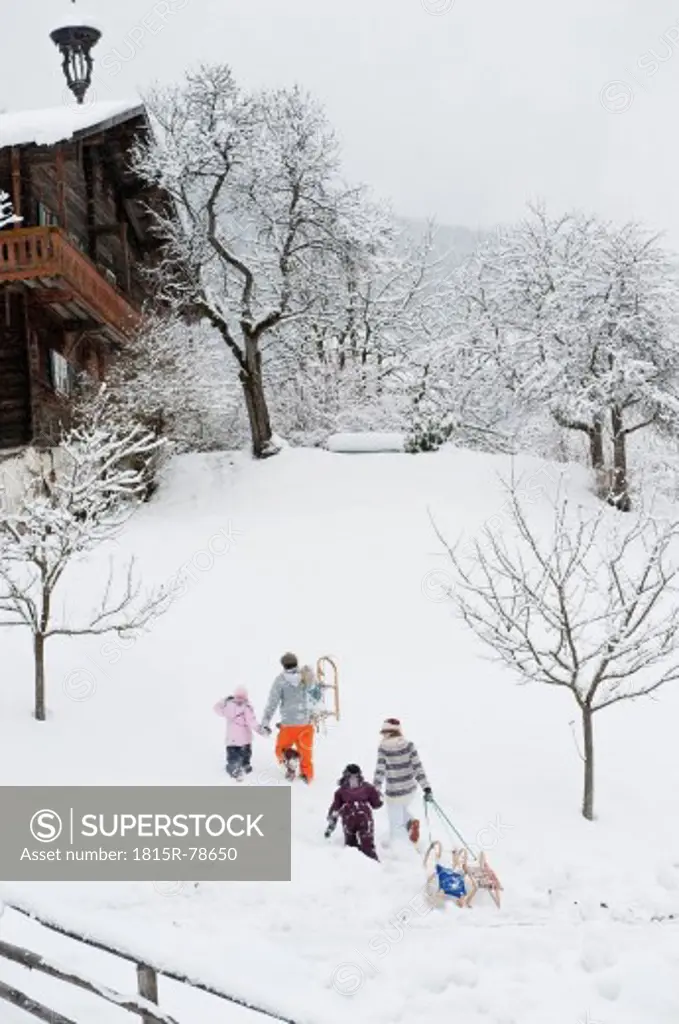 Austria, Salzburg, Hüttau, Family walking in the snow