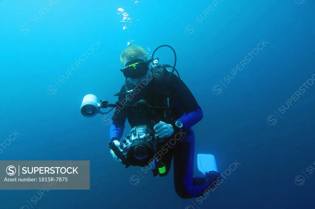 Diver with underwatercamera, Galapagos