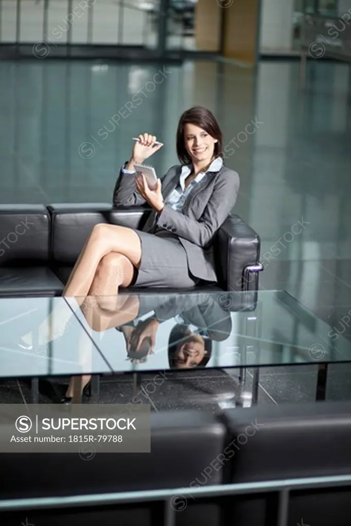 Germany, Bavaria, Business woman using PDAs
