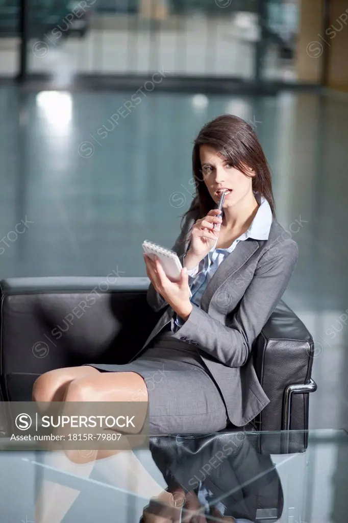 Germany, Bavaria, Business woman using PDAs