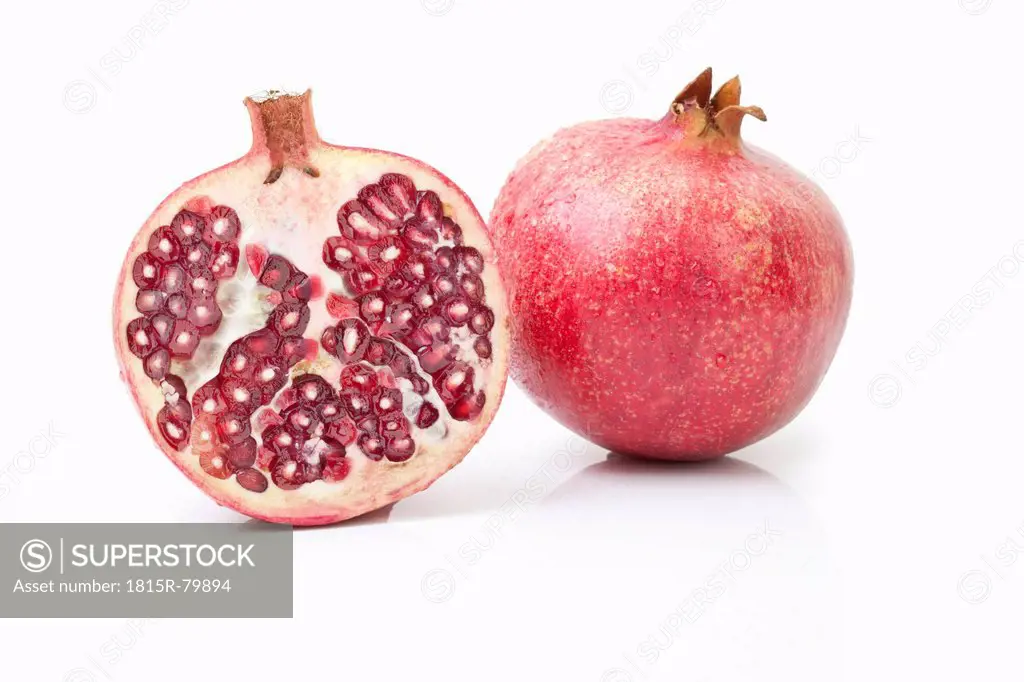 Sliced pomegranate in white background, close up