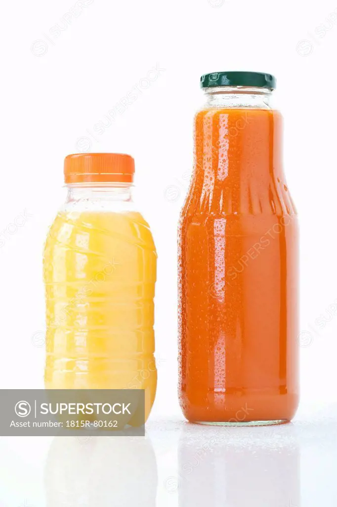 Carrot and orange juice bottle on white background