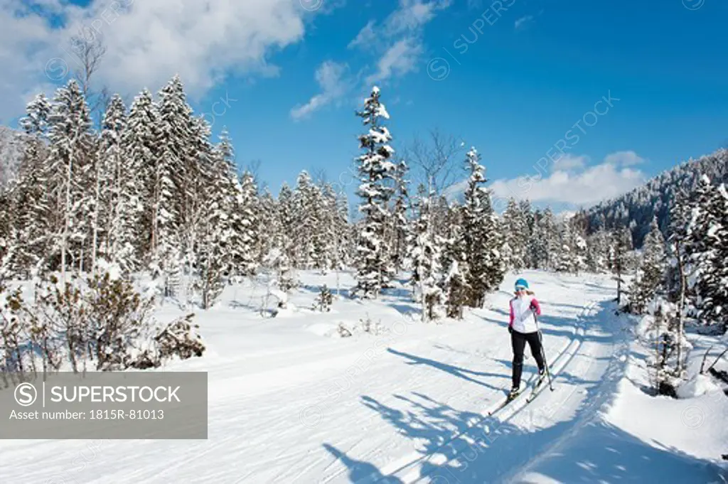 Germany, Bavaria, Aschermoos, Senior woman doing cross_country skiing