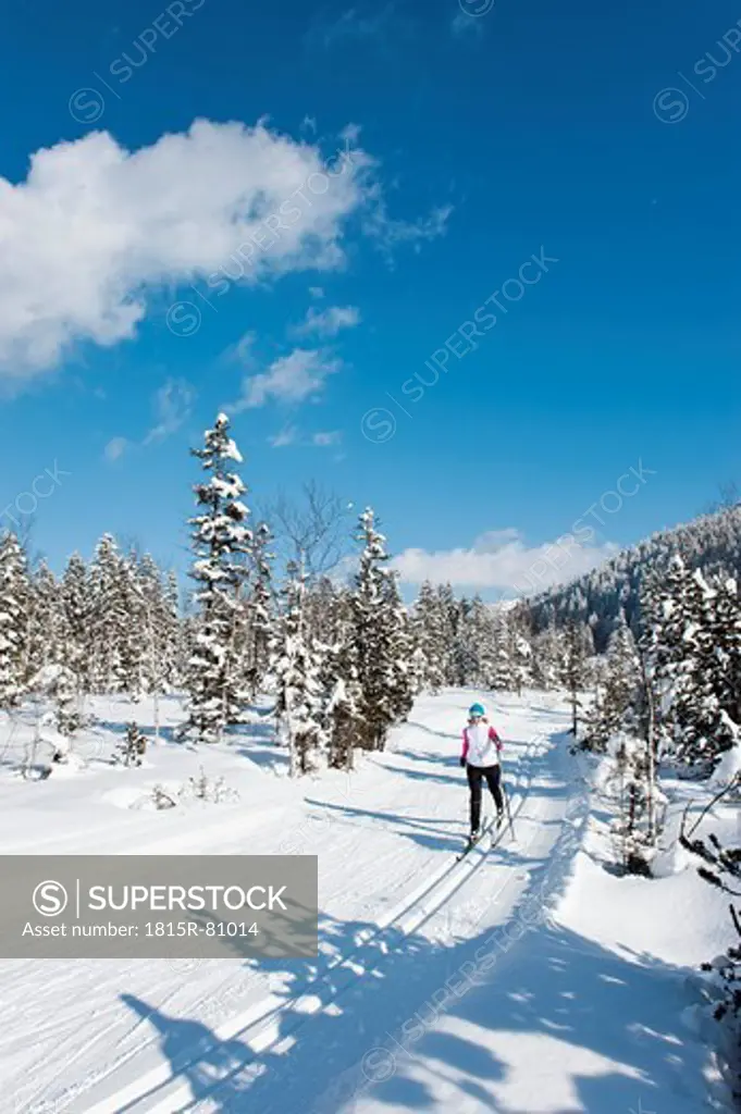 Germany, Bavaria, Aschermoos, Senior woman doing cross_country skiing