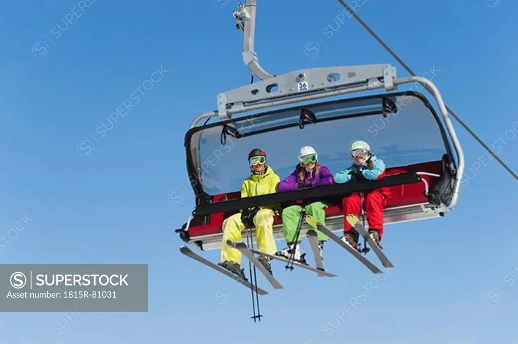 Italy, Trentino_Alto Adige, Alto Adige, Bolzano, Seiser Alm, Group of skiers using ski lift