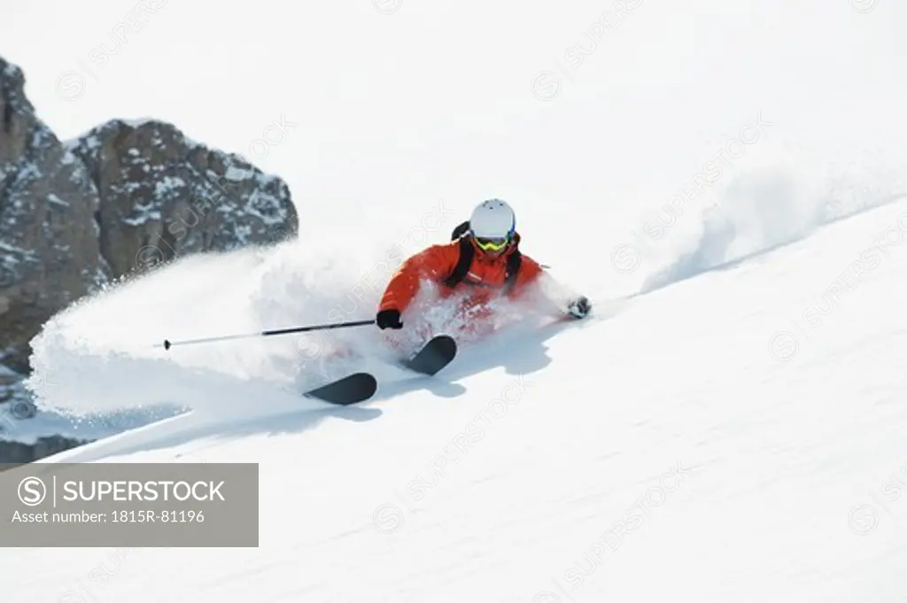 Austria, Kleinwalsertal, Man skiing, low angle view
