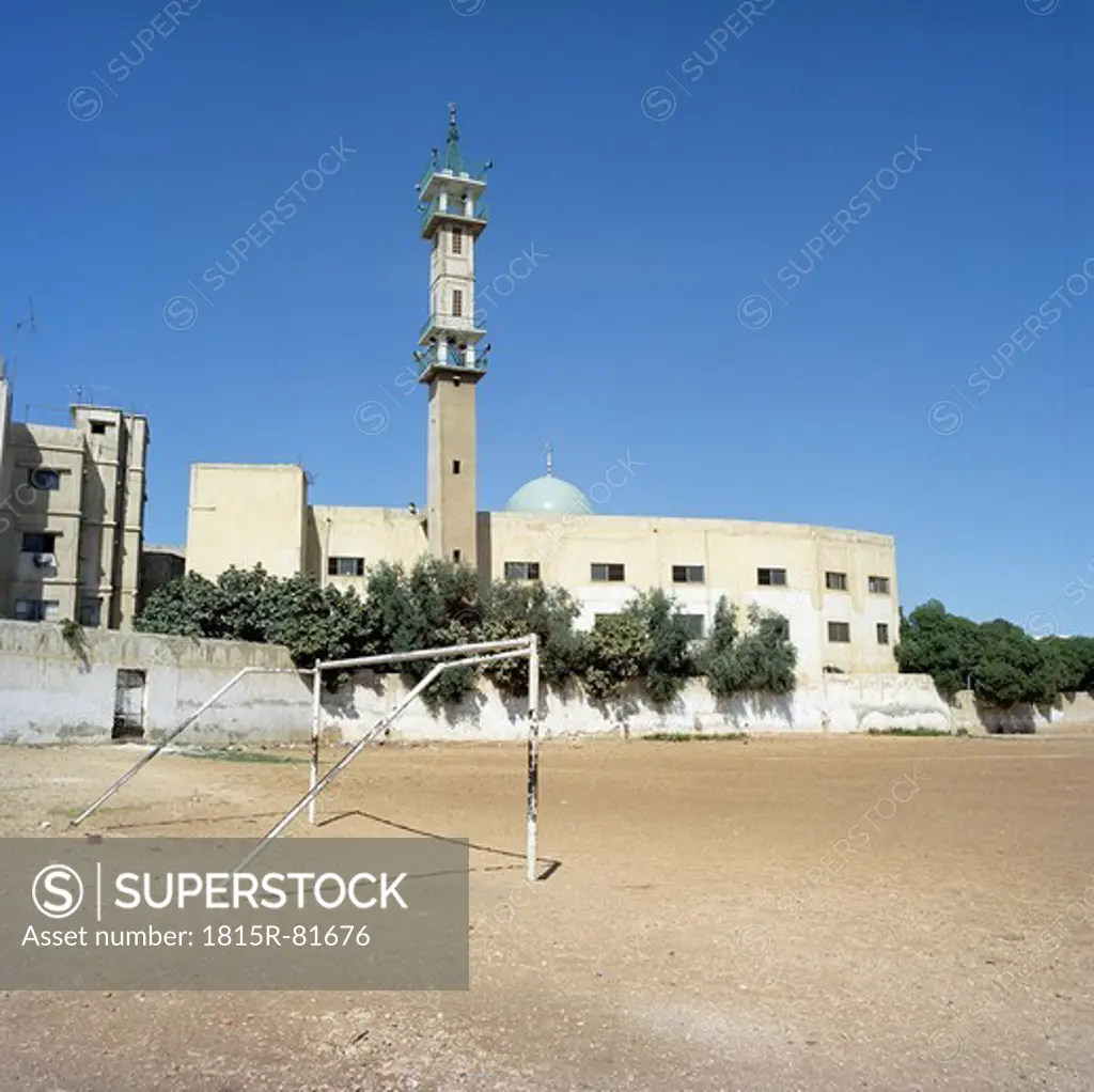 Jordan, Amman, View of empty scooer field with minaret in background