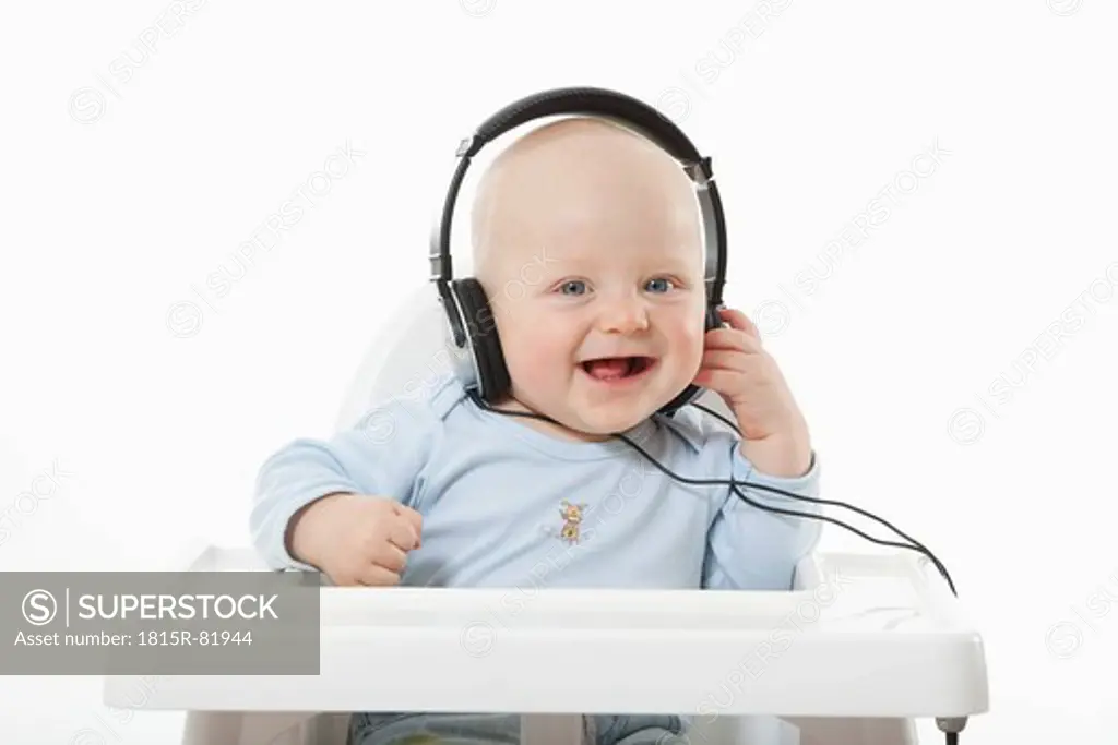 Baby boy 6_ 11 Months with head phone listening to music