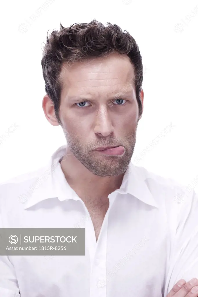 Young man biting lip, portrait, close-up