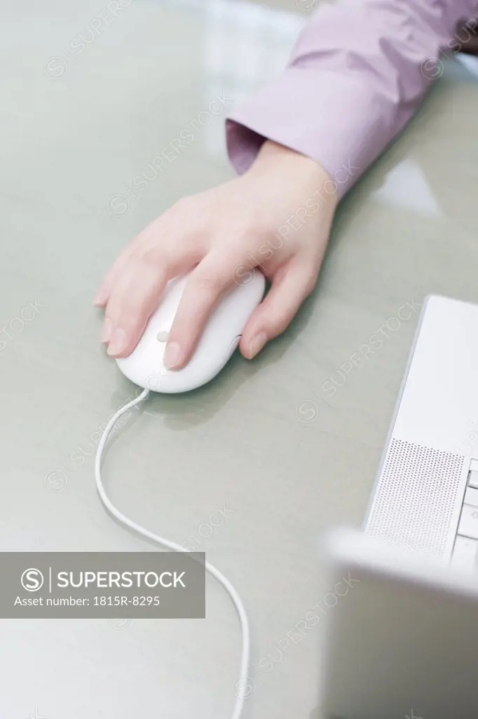Woman using computer mouse, elevated view