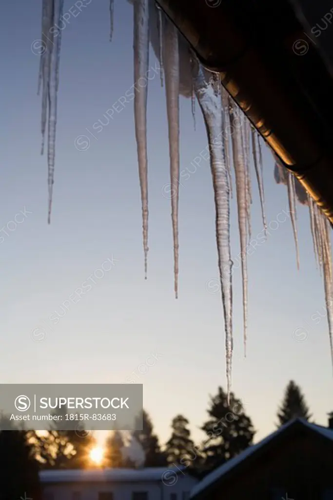 Germany, Bavaria, icicles at eaves gutter