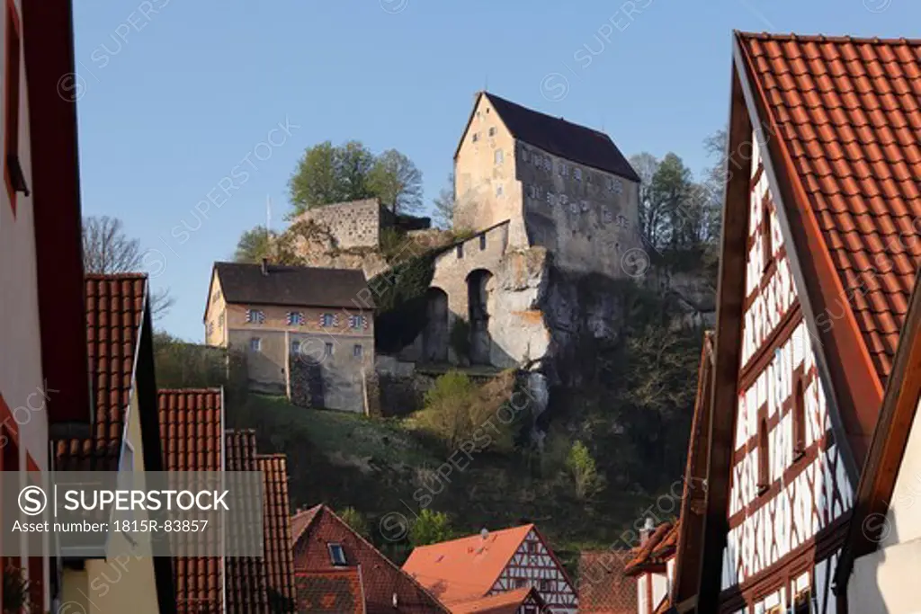 Germany, Bavaria, Franconia, Upper Franconia, Franconian Switzerland, Pottenstein, View of castle on top of mountain with town in foreground