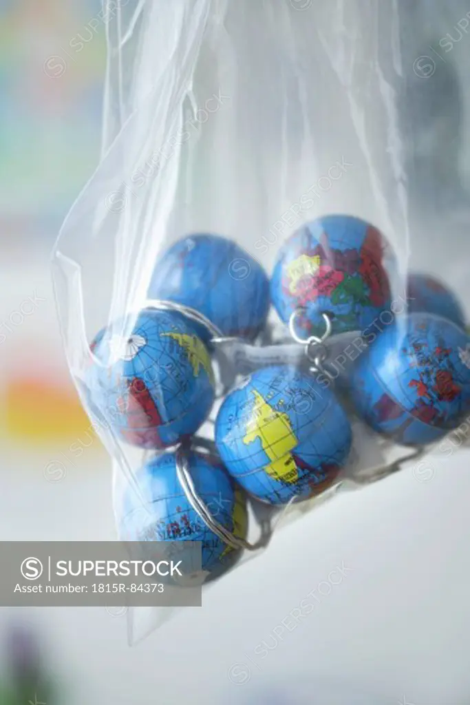 Europe, Germany, Close up of earth globes in plastic bag