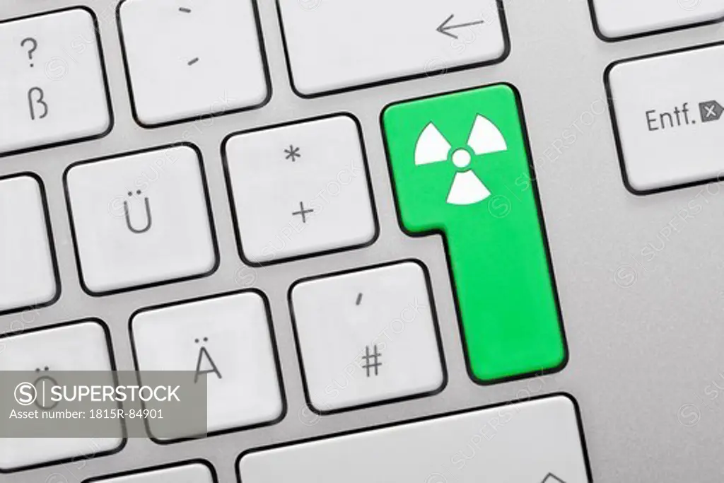 Close up of computer keys with atom symbol on green key