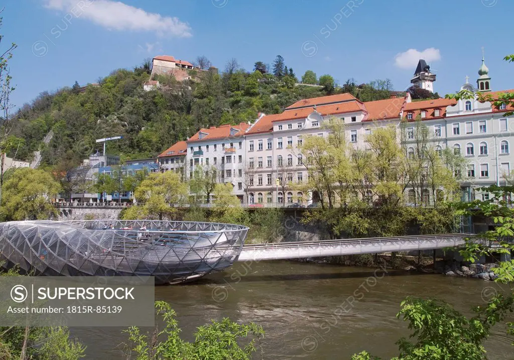 Austria, Styria, Graz, Tourist at murinsel with city in background