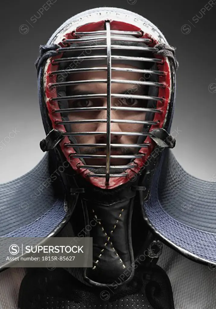 Kendo fighter with face mask, portrait