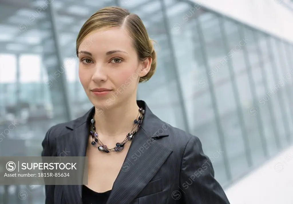 Romania, Young woman in office, portrait
