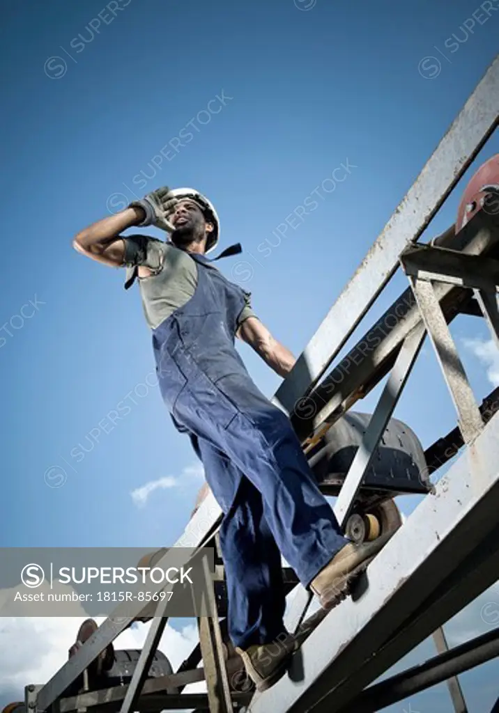 Germany, Augsburg, Worker calling from steel construction