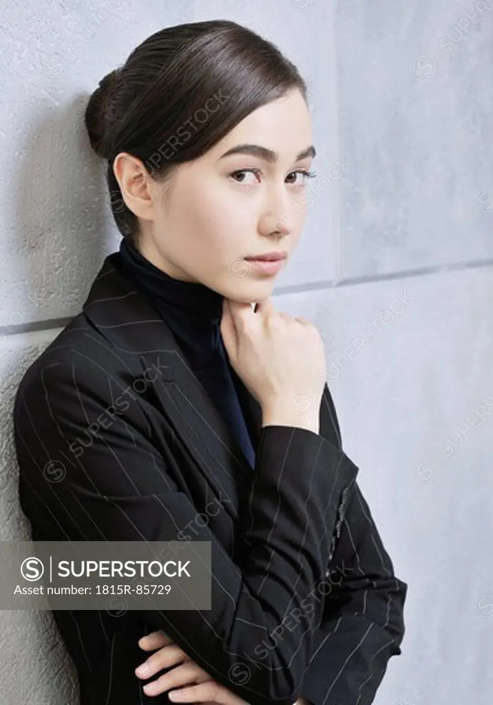 Teenage girl in dark jacket, portrait