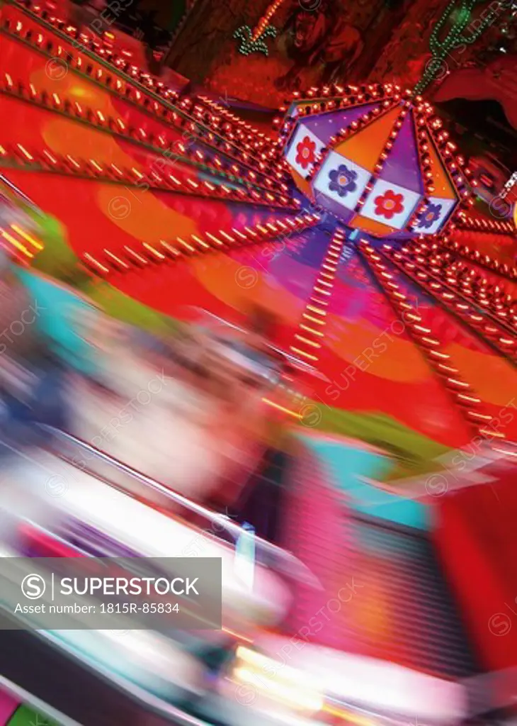 Germany, View of rotating carousel at night