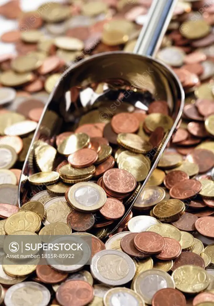 Close up of variety of euro coins with shovel