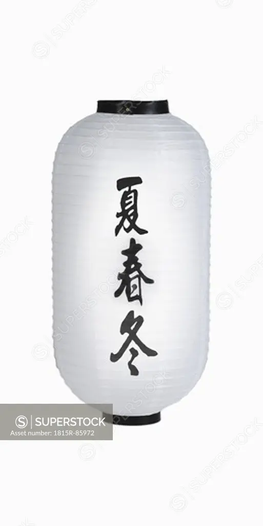 Asian paper lantern against white background, close up