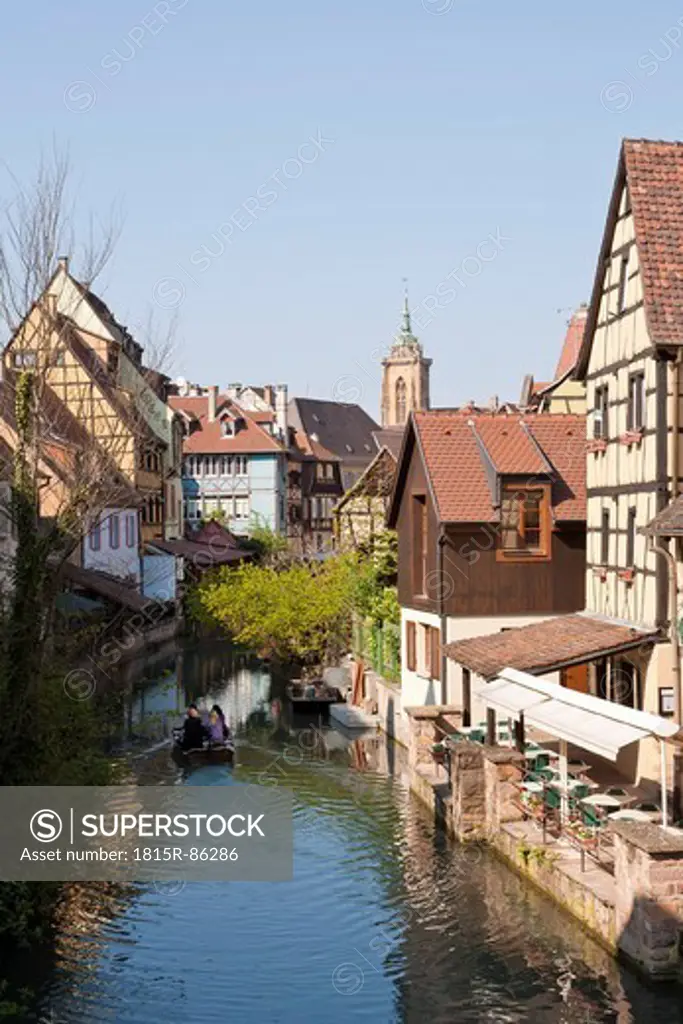 France, Alsace, Colmar, Krutenau, View of La Petite Venise quarter and people in boat at Launch river