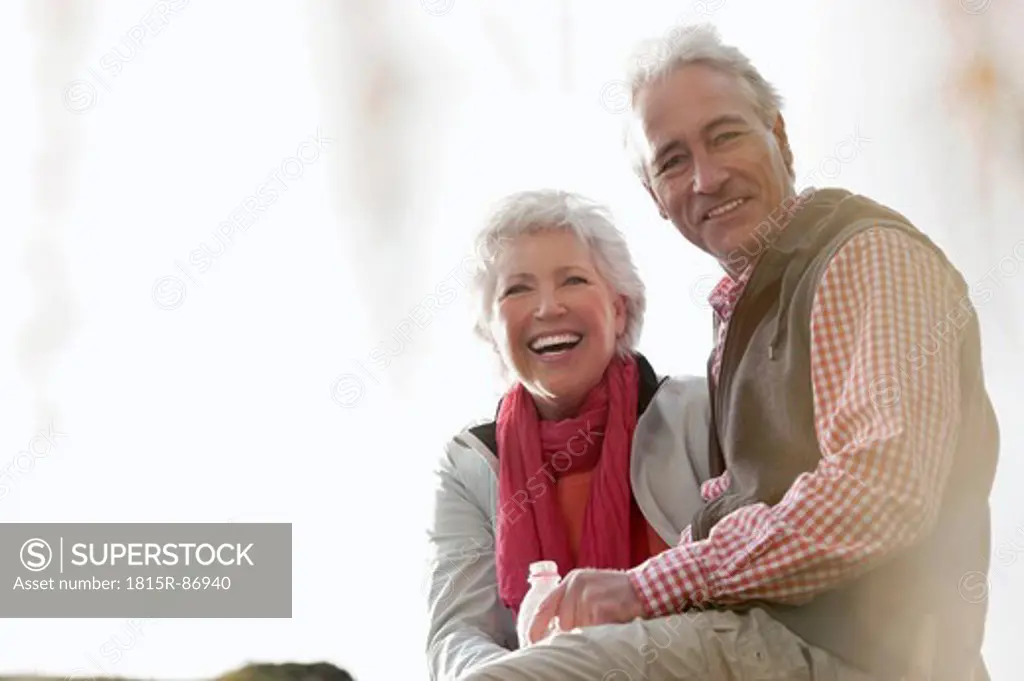 Italy, South Tyrol, Mature couple hiking on dolomites, smiling, portrait