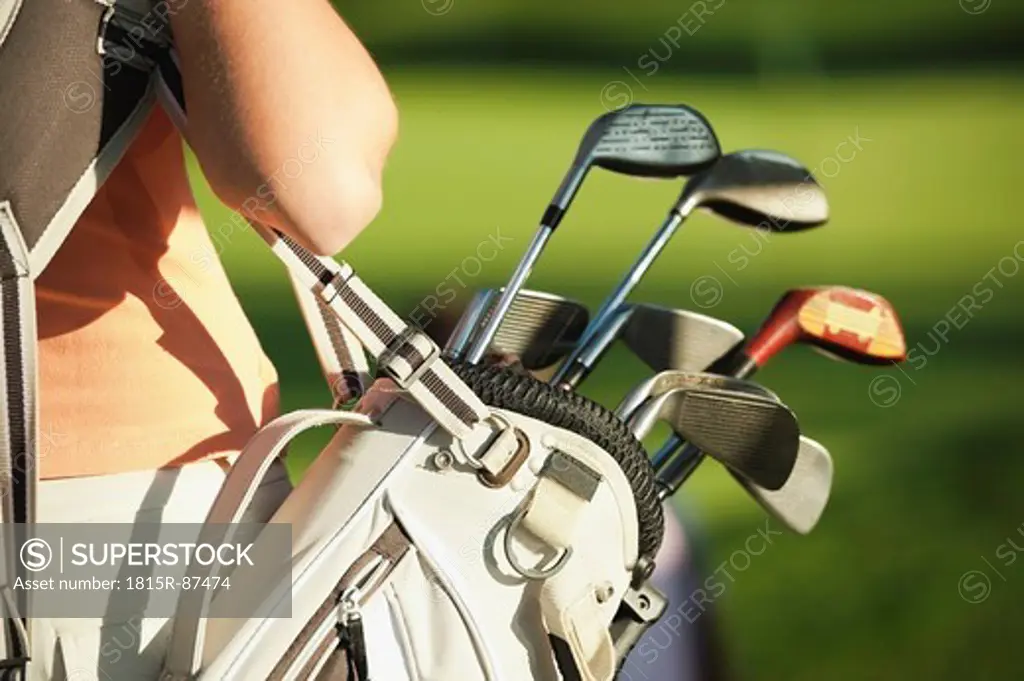 Italy, Kastelruth, Mid adult woman with golf bag, close up