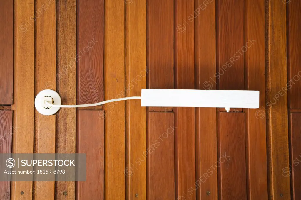 Wall lamp mounted on a wooden wall