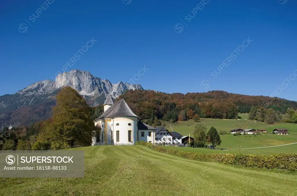 Germany, Bayern, Berchtesgadener Land, View of church with untersberg mountain in background