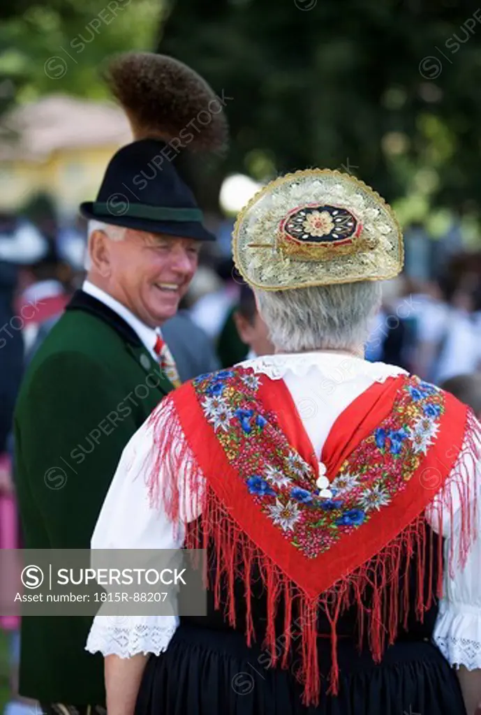 Austria, Salzburg, Senior woman and man wearing traditional costume and hat