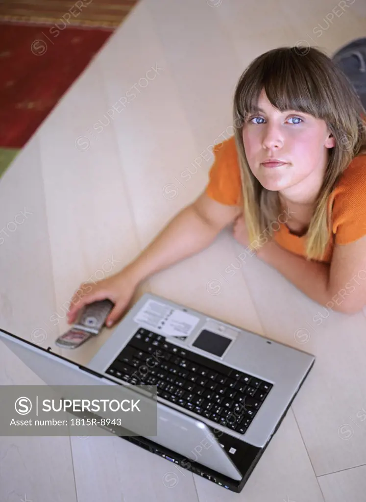 Woman with laptop and mobile phone, elevated view