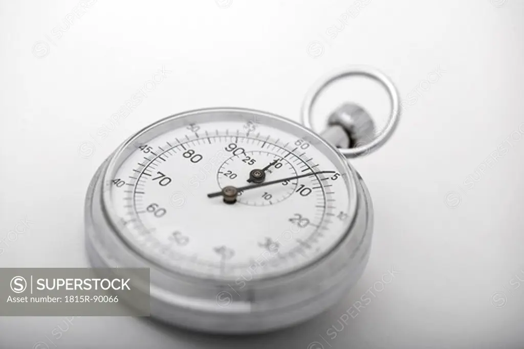 Close up of classic analog stop watch on white background