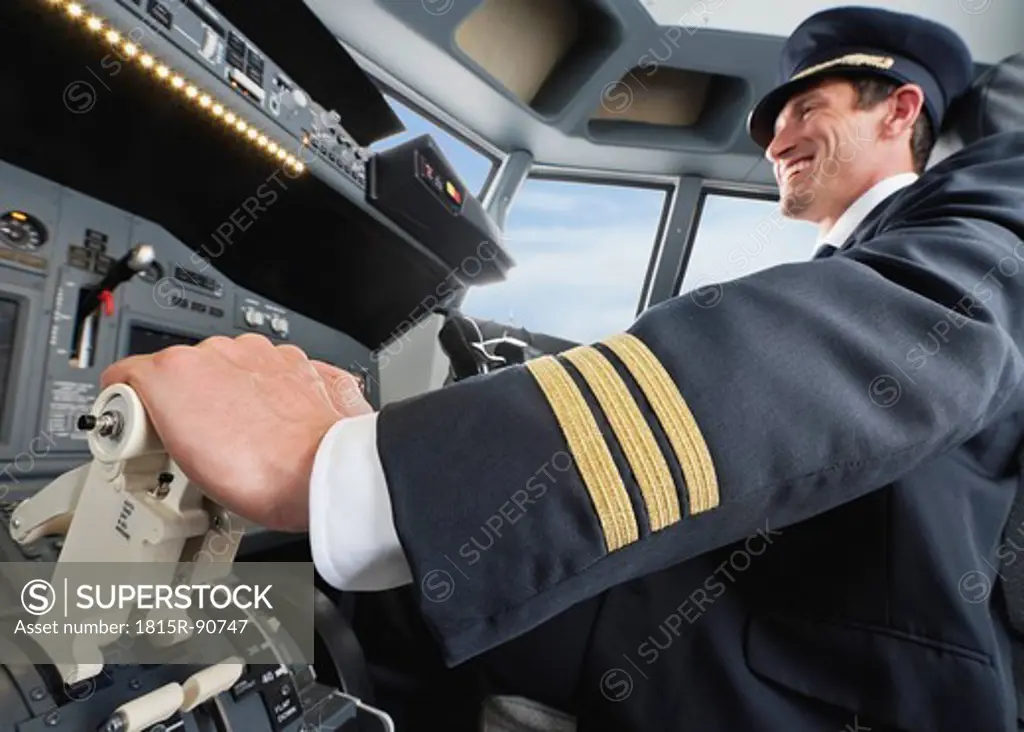 Germany, Bavaria, Munich, Pilot piloting aeroplane from airplane cockpit