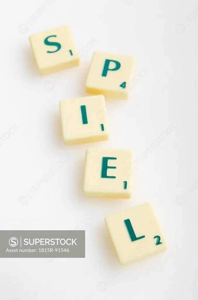 Scrabble game with word Spiel on white background