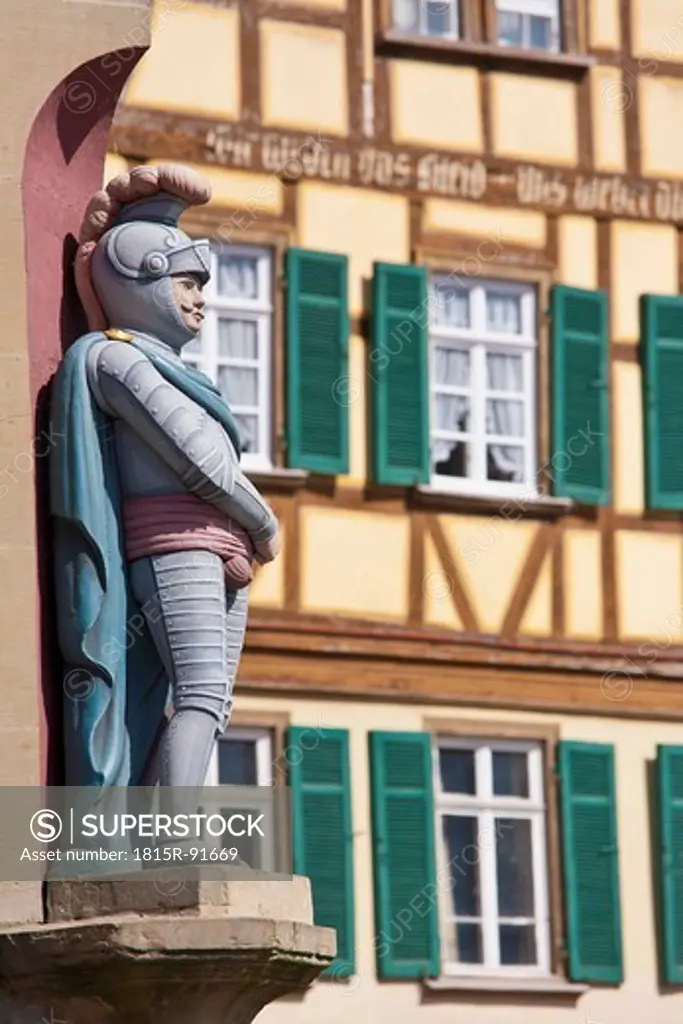 Germany, Baden_Wurttemberg, Schwabisch Hall, Old statue of cavalier with framed house in background
