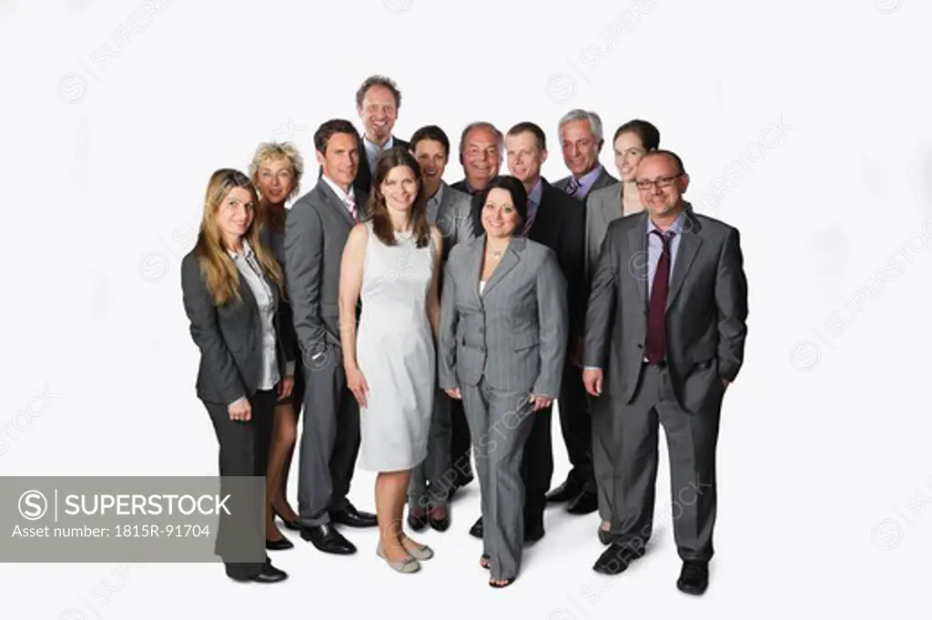 Large group of business people standing against white background