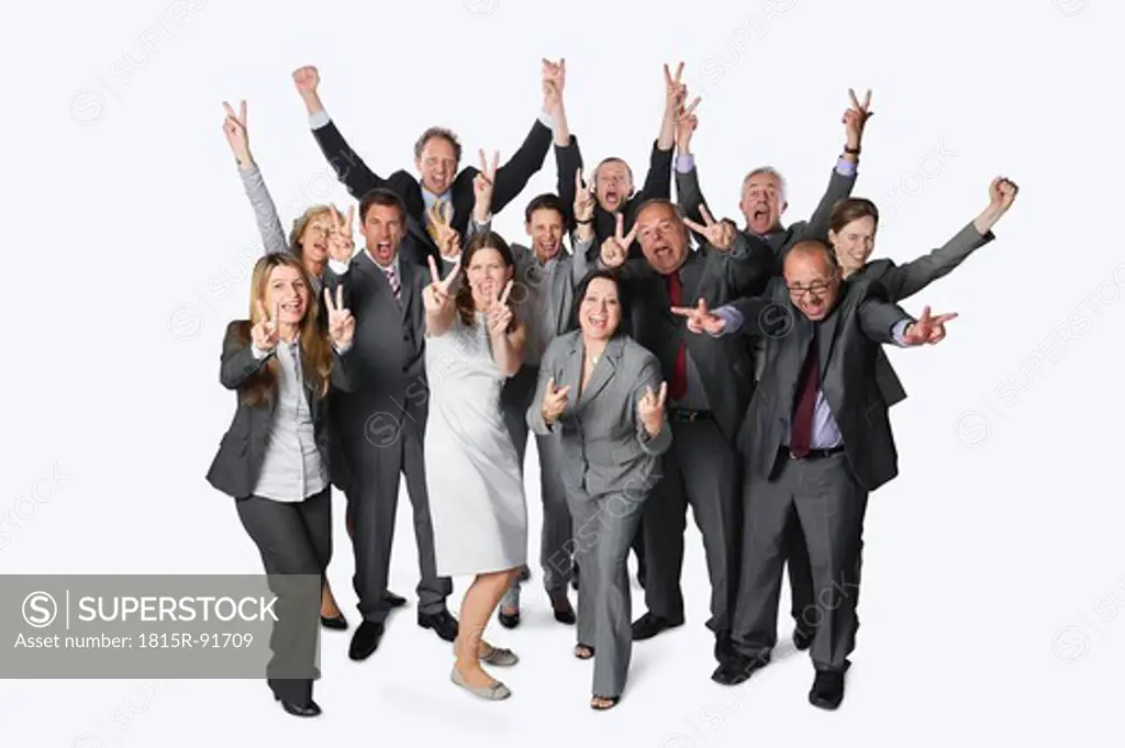 Large group of business people with victory sign against white background
