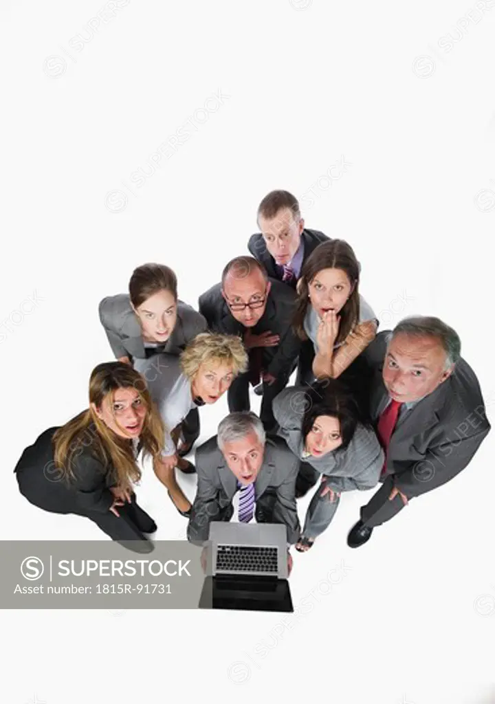 Business people looking at laptop against white background