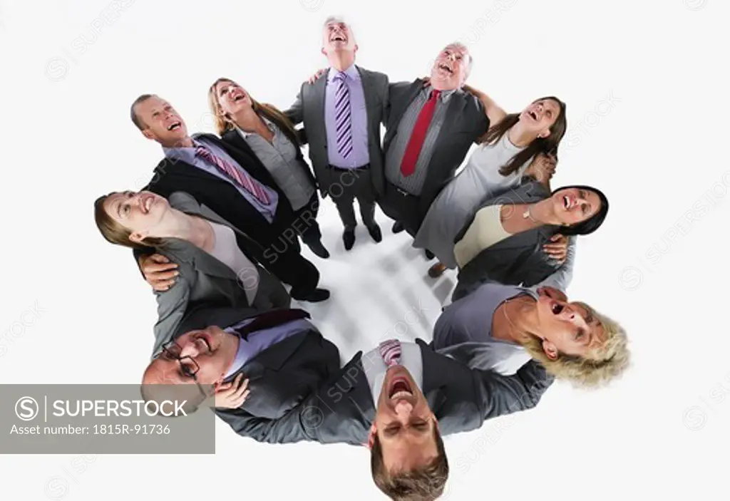Business people forming huddle and looking up against white background